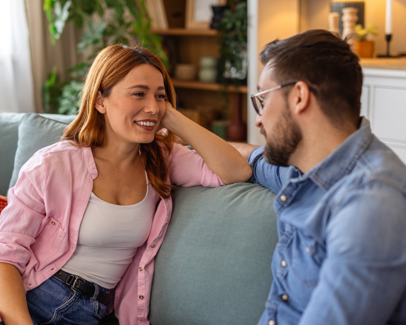 Couple sitting together in natural light, reflecting quietly during a midlife transition and menopause journey