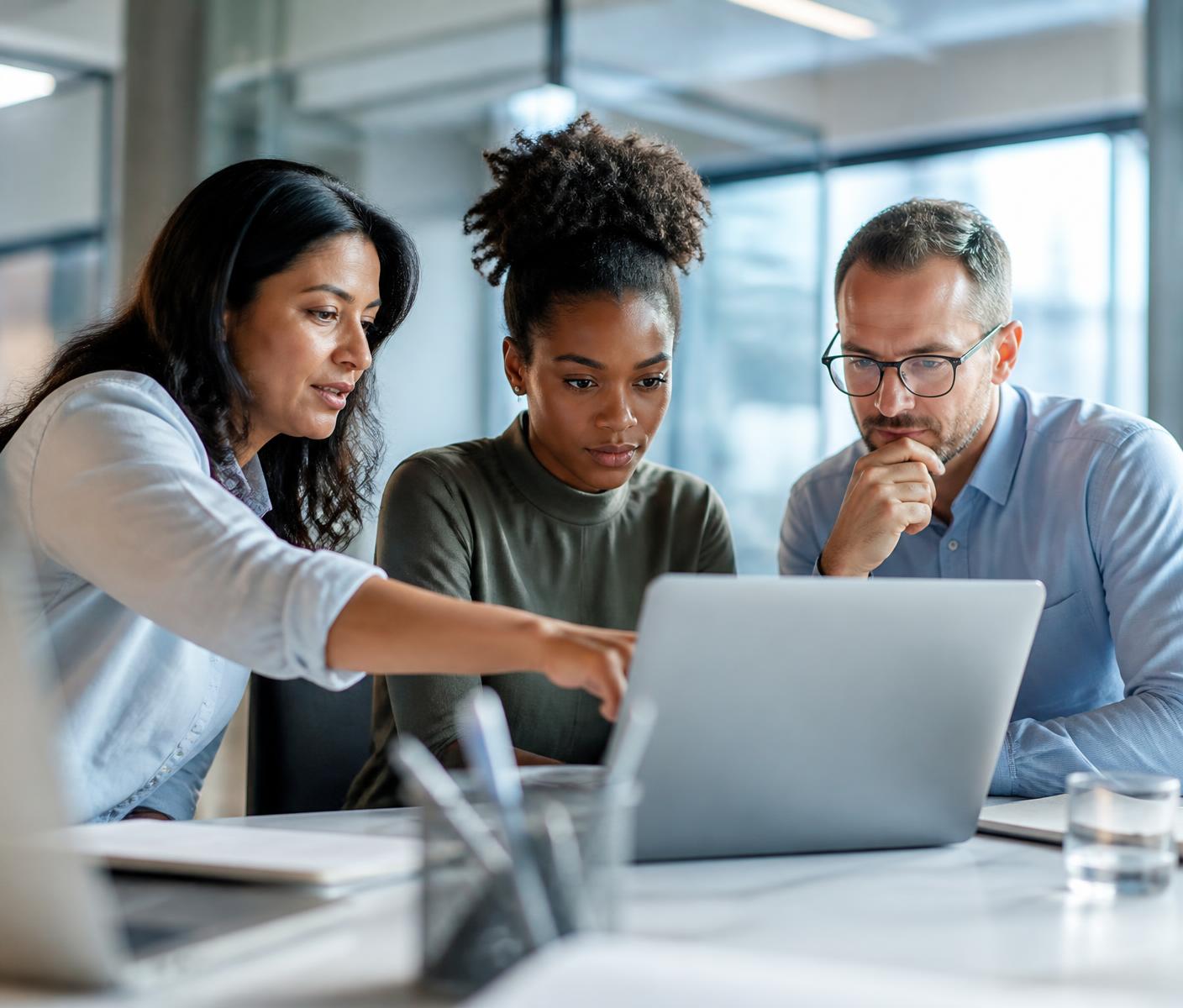 Colleagues working through a lesson together at a laptop
