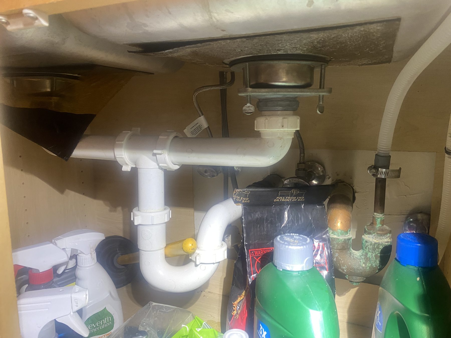 Under-sink plumbing before repair