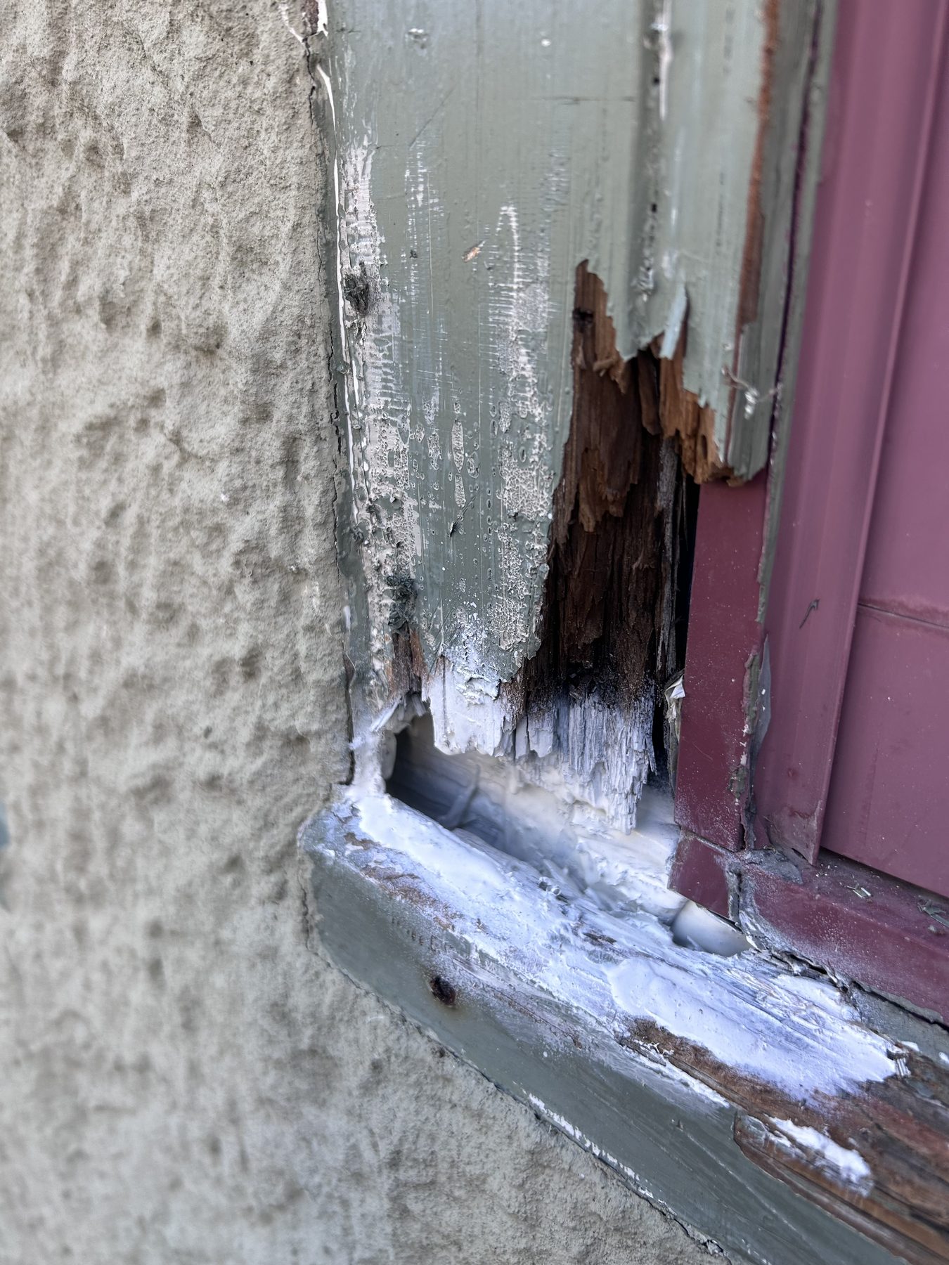 Exterior wood trim damage before repair