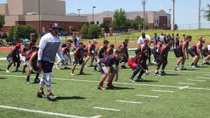 football players working out on field