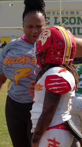 mom and her young football player