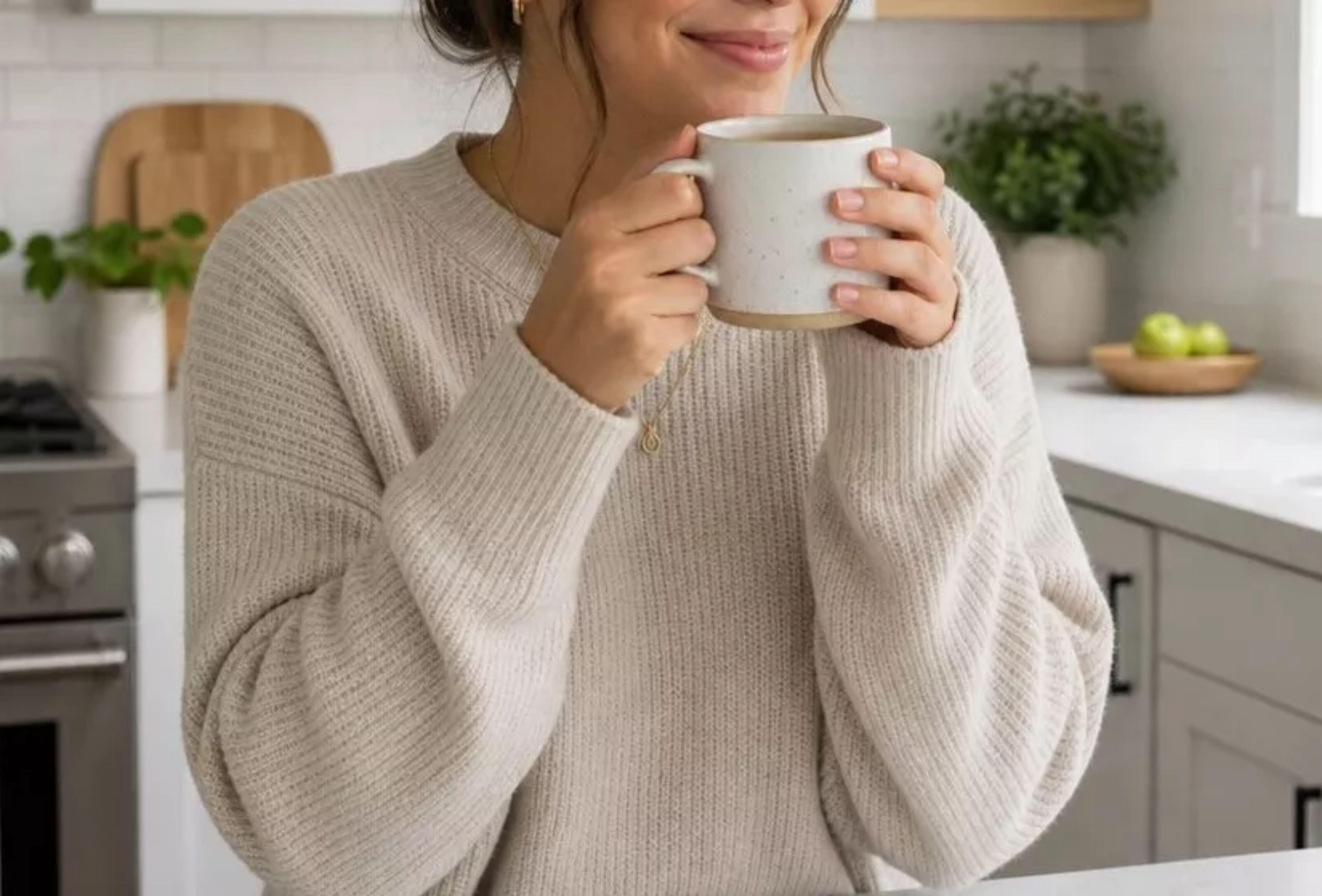 A person relaxing in a clean kitchen after house cleaning services
