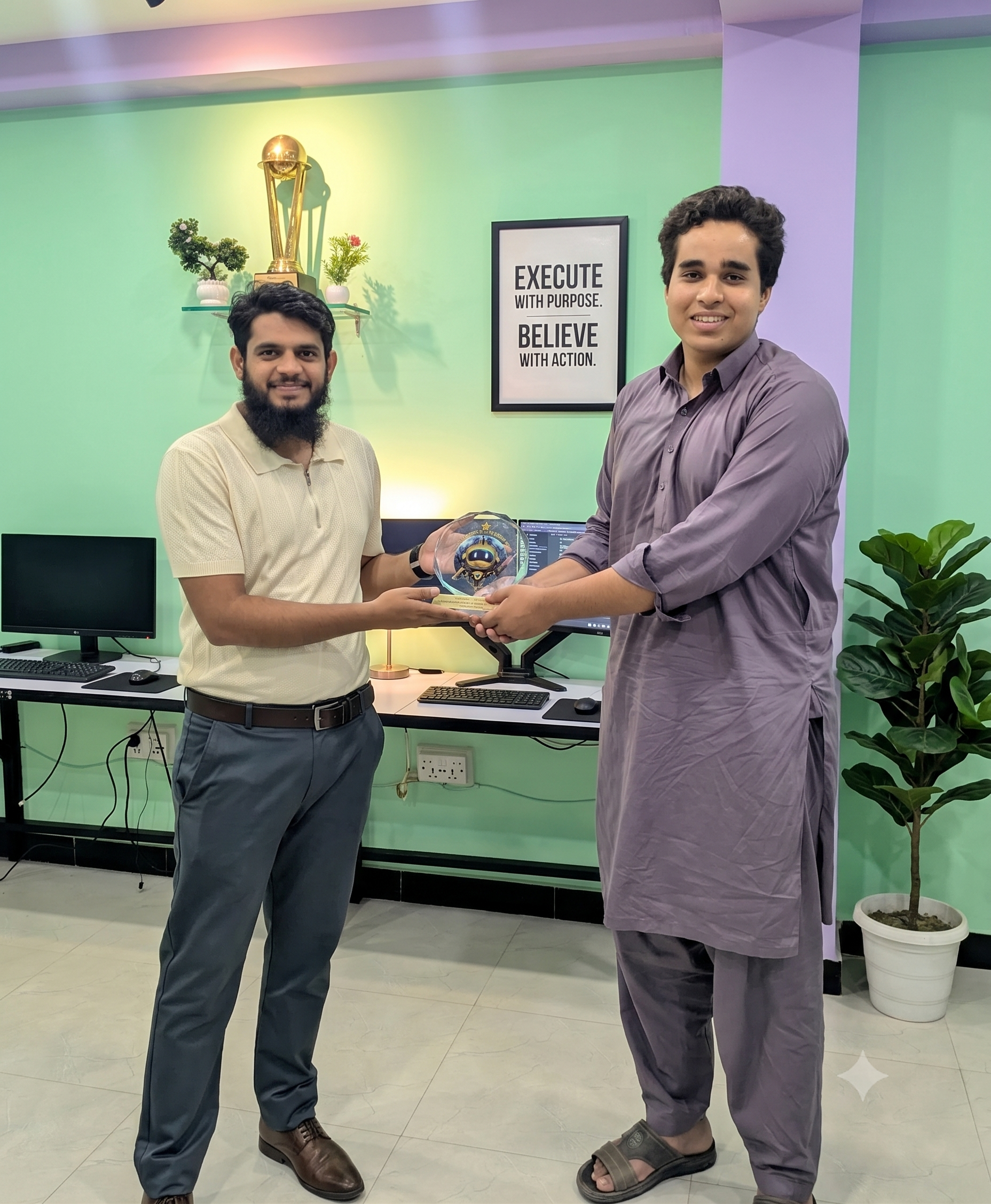 CEO Husnain Sultan, Zohaib, and Abdul Hanan presenting the Performance Shield to Raja Hasham