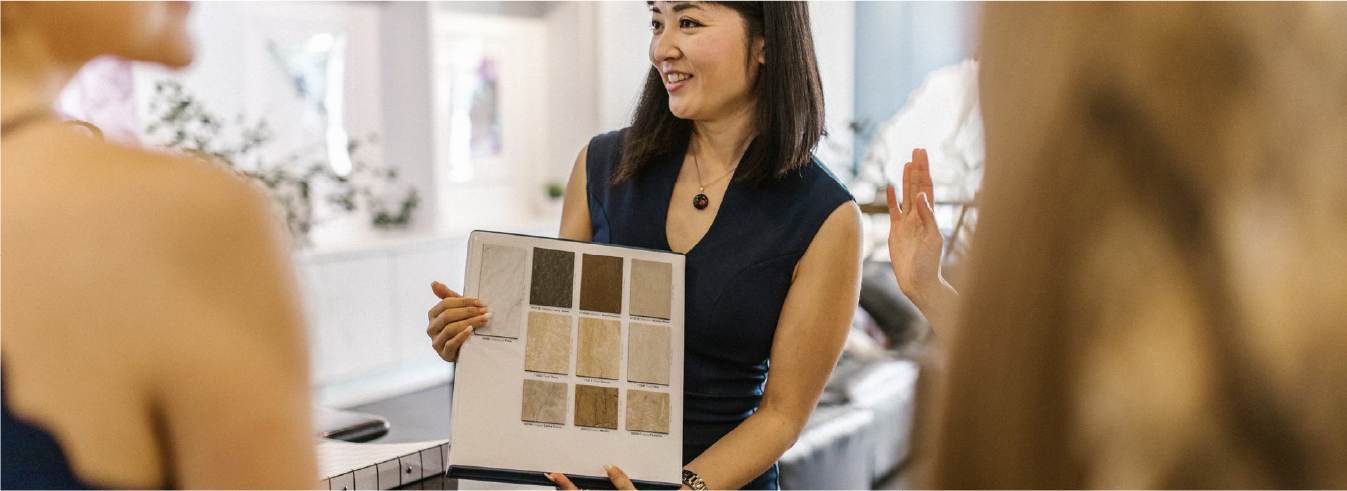 Interior designer presenting material samples to clients.