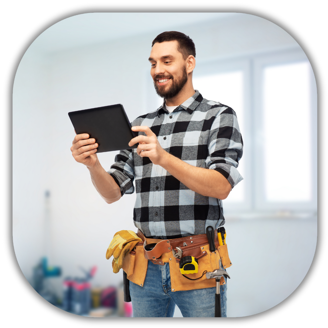 Smiling residential contractor holding a tablet while wearing a tool belt in a home renovation setting, showcasing a professional and approachable image for a lead generation and sales strategy service.