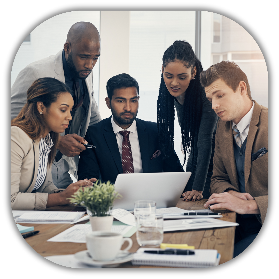 Group of diverse professionals collaborating around a laptop, symbolizing personalized service and strategic planning tailored to your needs.