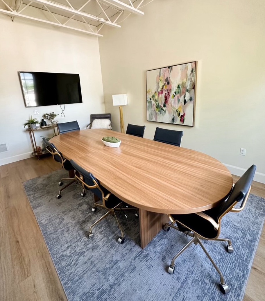 Bright second-floor office with tall windows