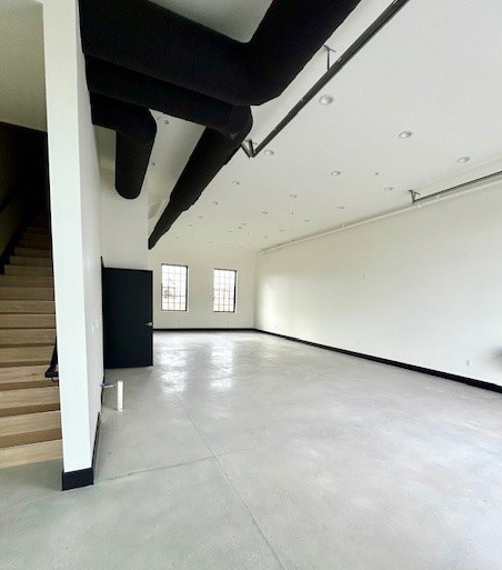 Open shell unit with staircase and exposed ductwork