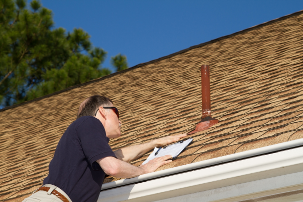Homeowner checking his roof