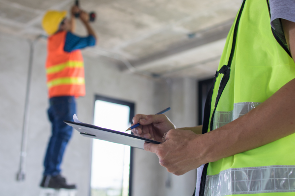 Worker Walking Around Inspecting the Property