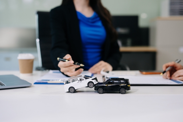 A relatable driver reviewing a policy or having a helpful conversation with an insurance professional.