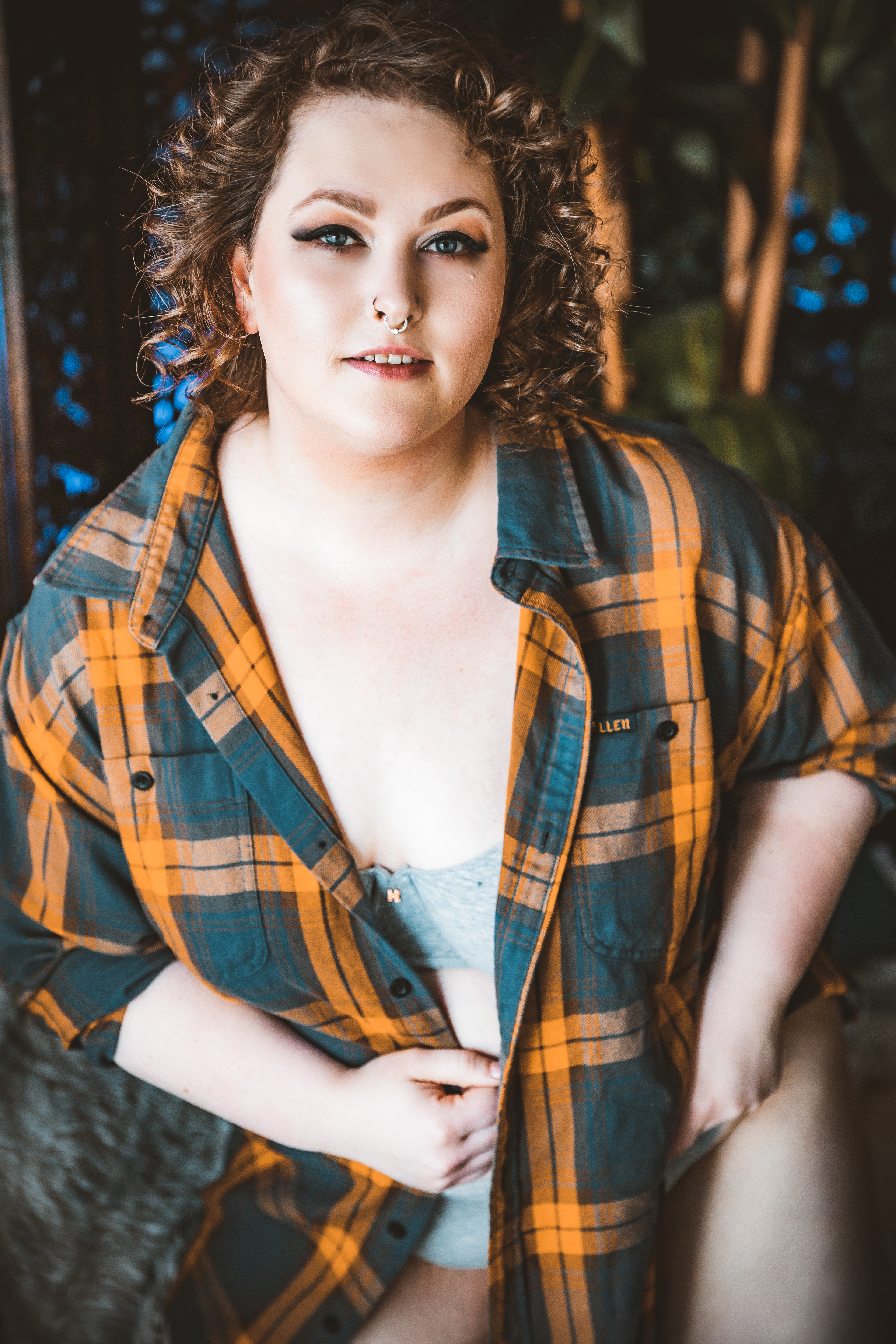 woman wearing green and orange flannel