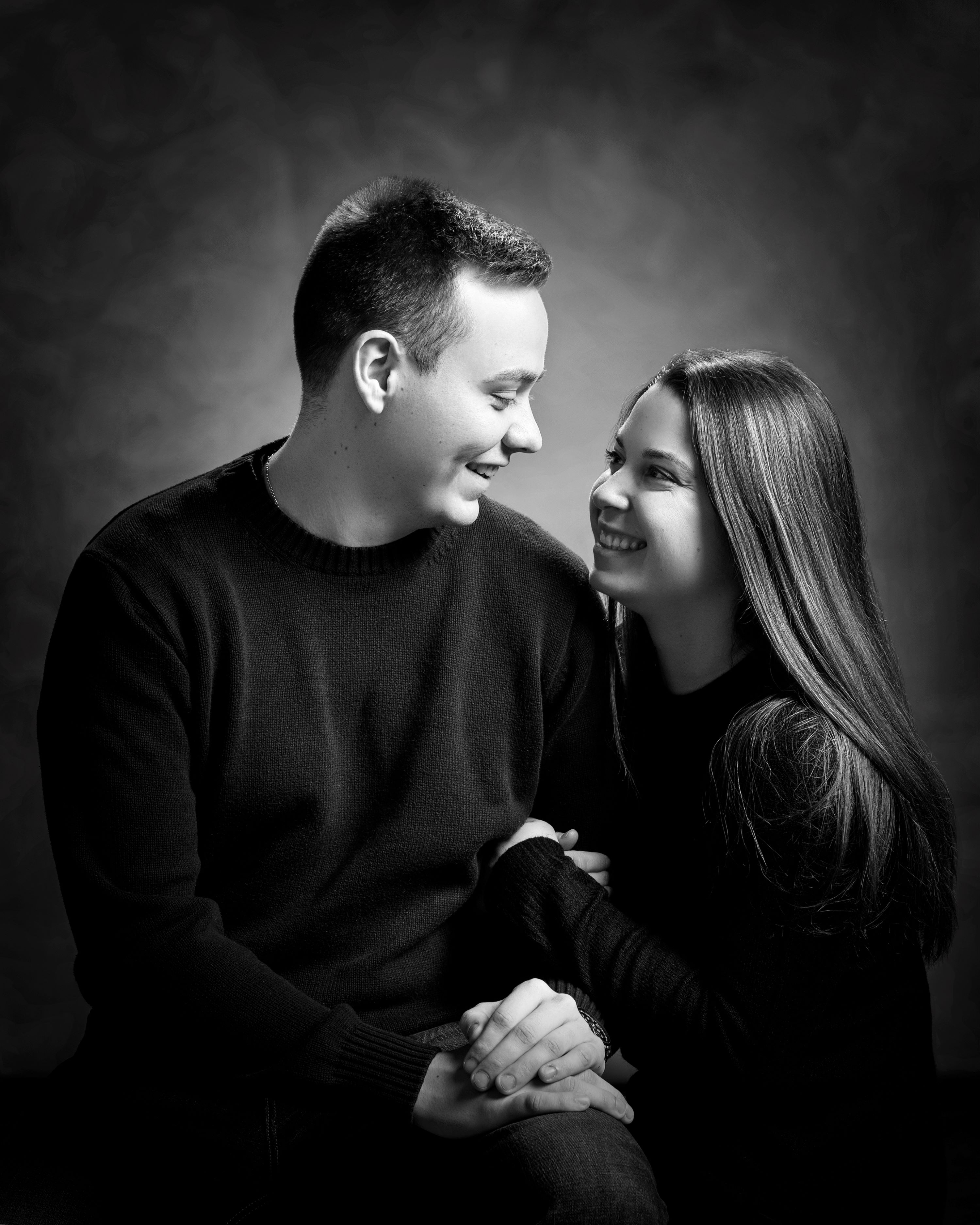 black and white studio portrait of young couple
