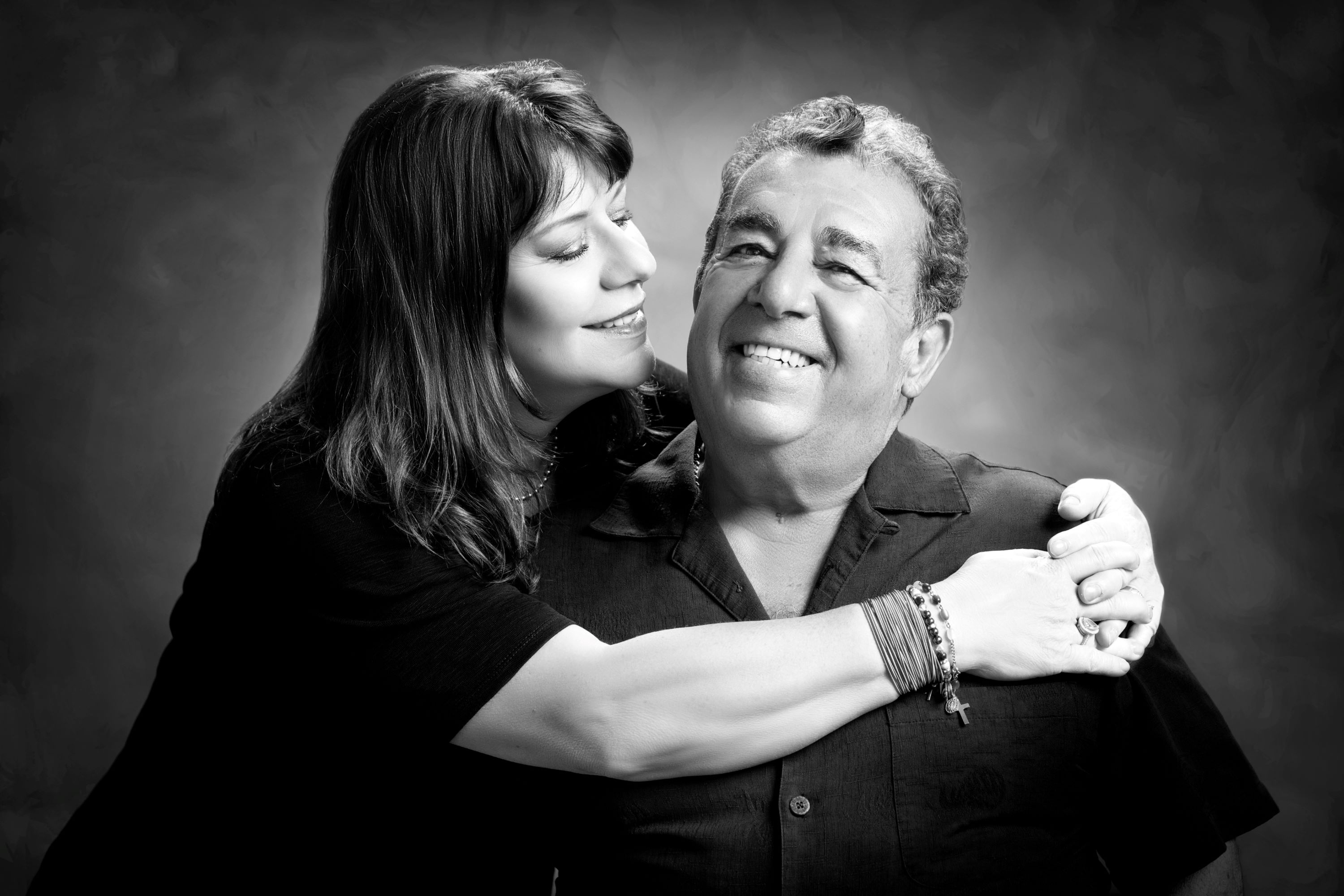 black and white studio portrait of couple