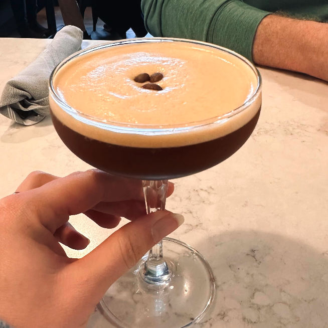 Craft espresso martini topped with coffee beans at Rushing Trading Co.