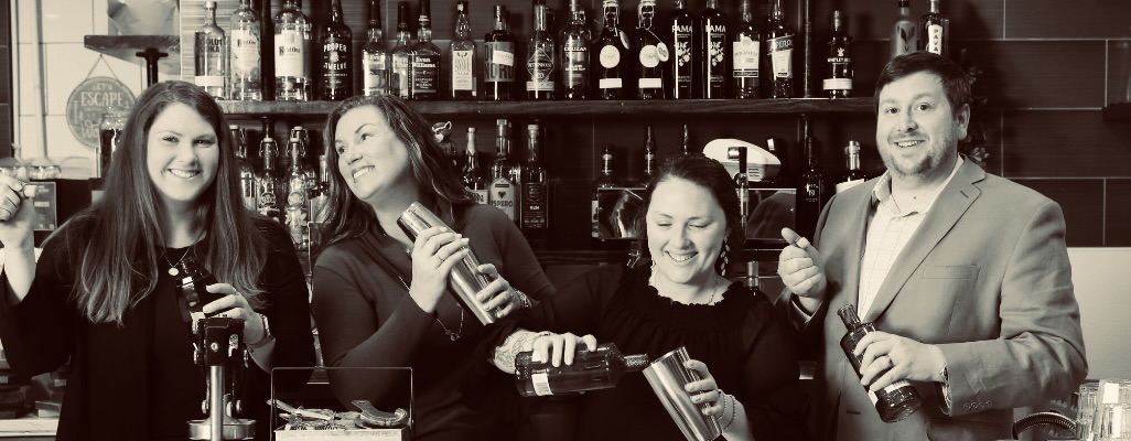 The Rushing Trading Co. family and team behind the bar: Mattie Costener, Amber Rushing, Annabel Adams, and Jason Hines