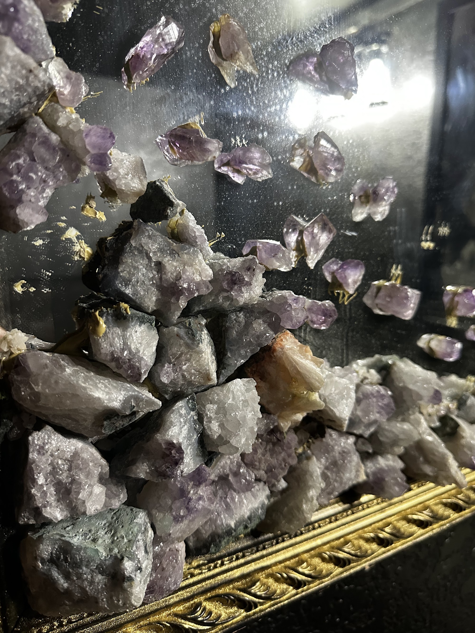 Amethyst crystal clusters in Brew-Ja's display case