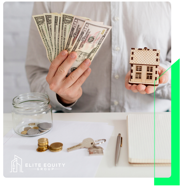 Cash and a model house on a desk beside a savings jar