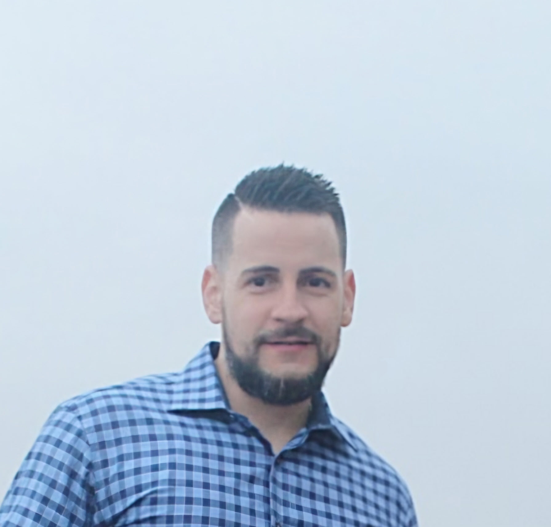 Danny, owner and lead barber at Primo's Barber Shop in Jupiter, FL