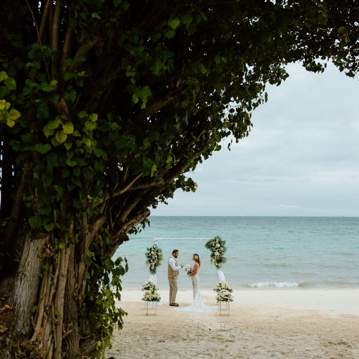 couple exchanging vows during island hopping elopement