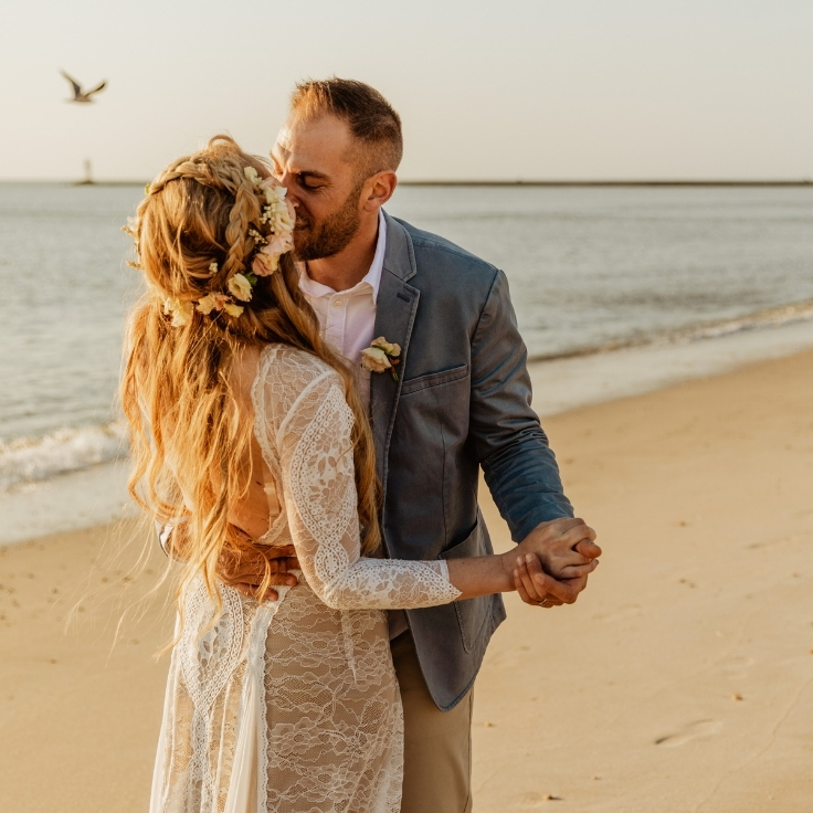 mermaid bride laughing and playing on beach with groom at sunset during Cape May elopement mermaid bride laughing and playing on beach with groom at sunset during Cape May elopement
