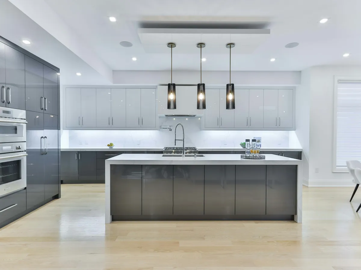 Kitchen in Lees lit by LED downlights and pendant lights