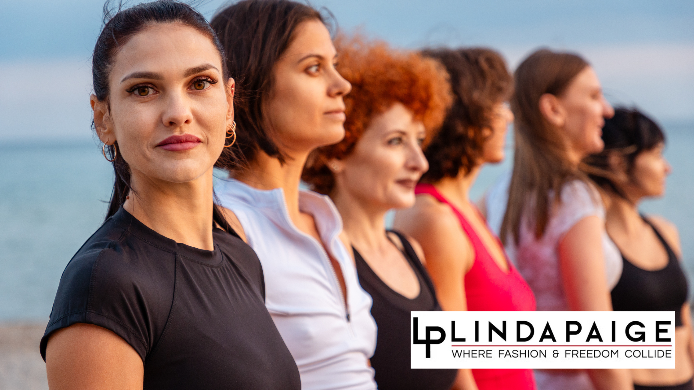 A group of woman standing next to each other, some hiding from being seen.
