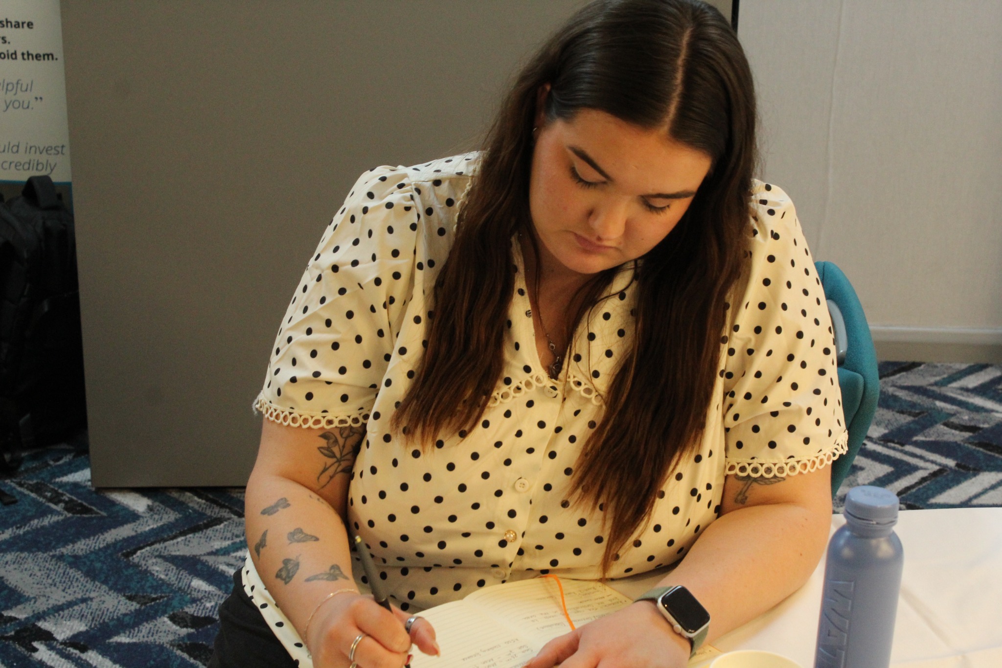 An attendee working on her property plans at an SCS masterclass