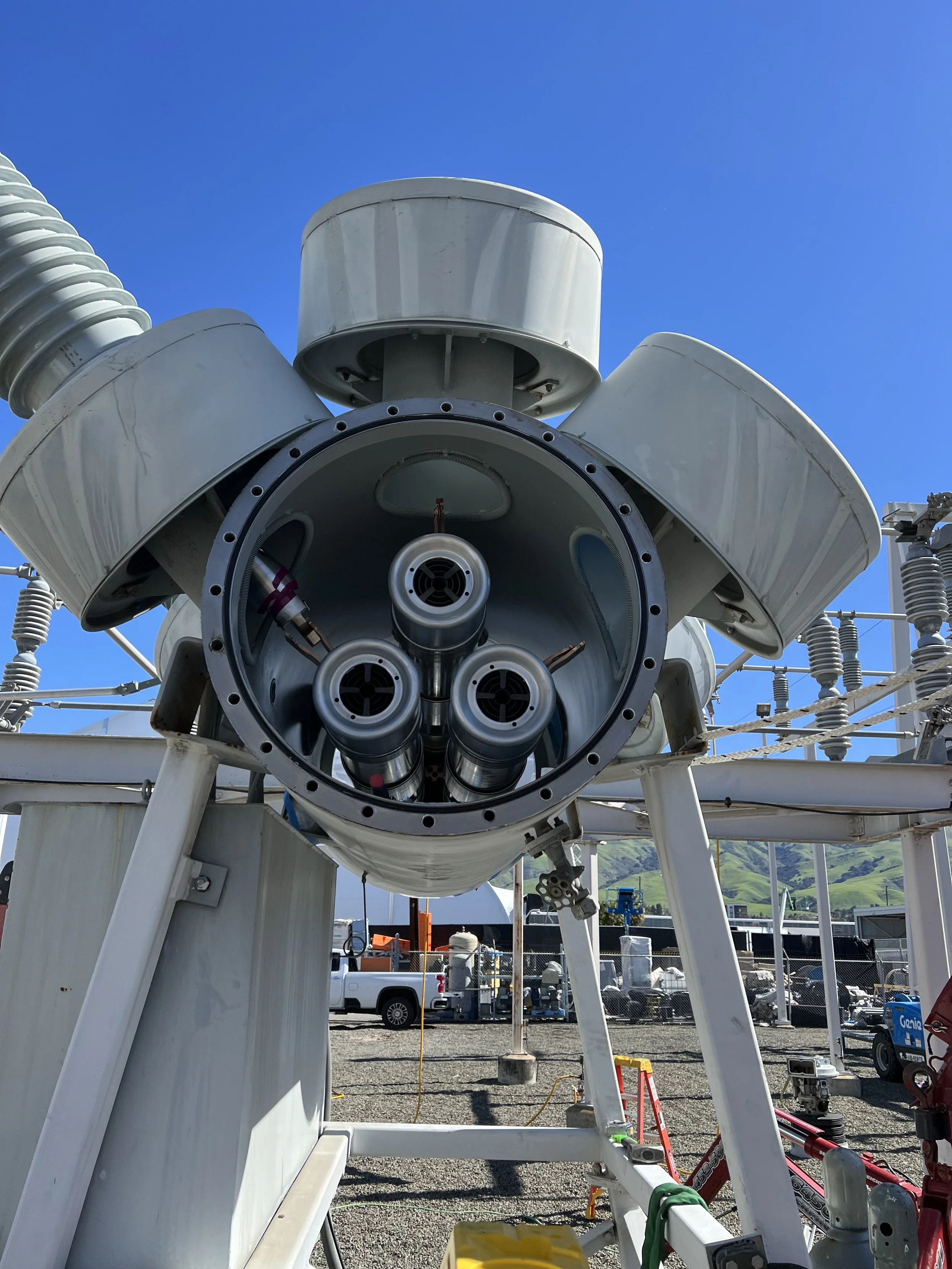 High-voltage circuit breaker with bushings at a substation facility
