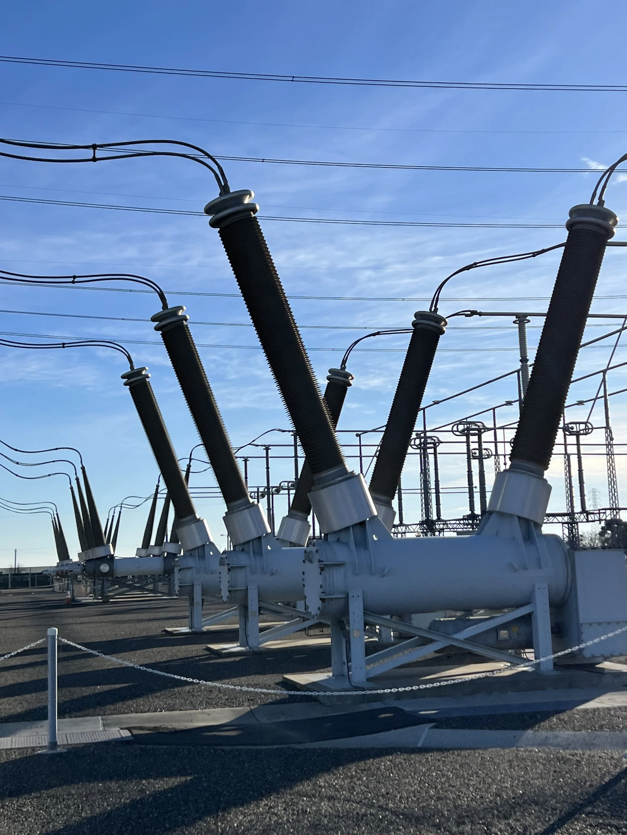 SF6 high-voltage circuit breaker bushings at a substation