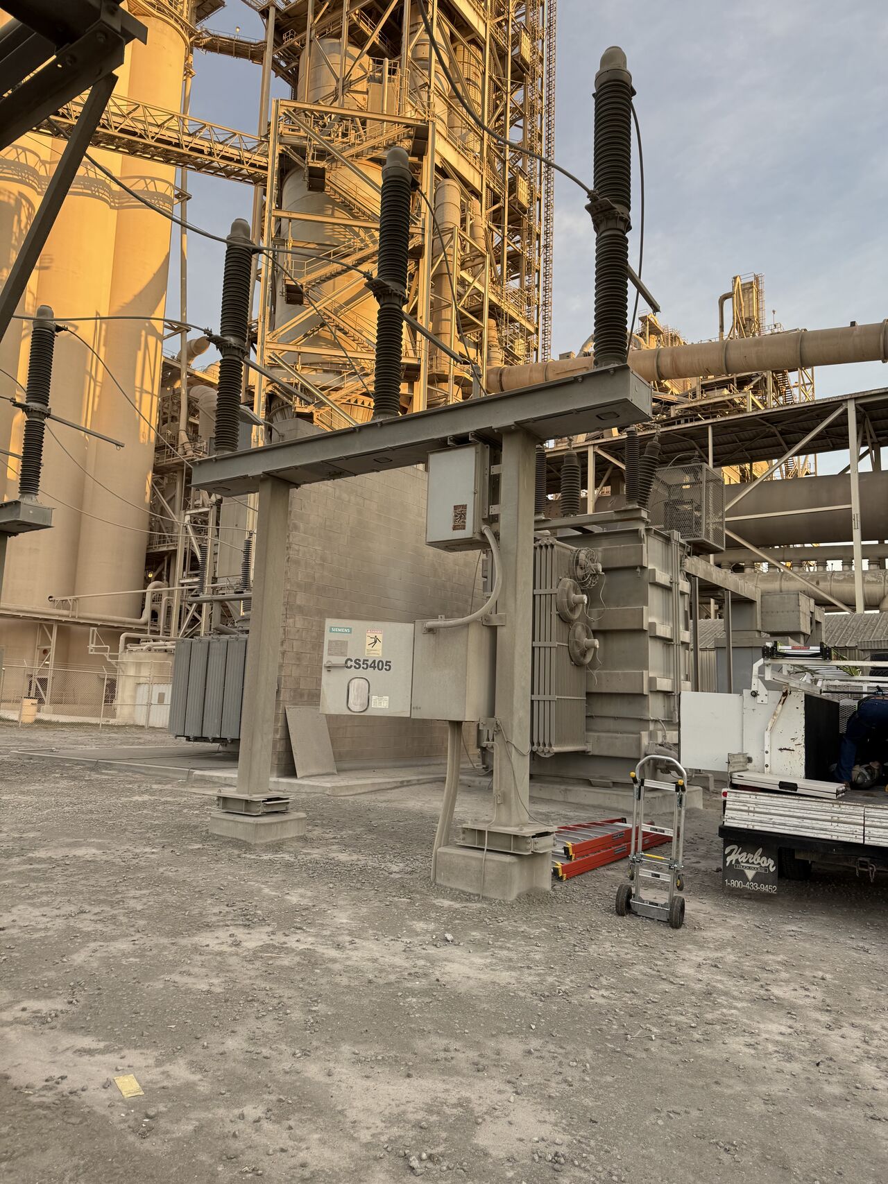 Large power transformer in substation with bushing connections visible
