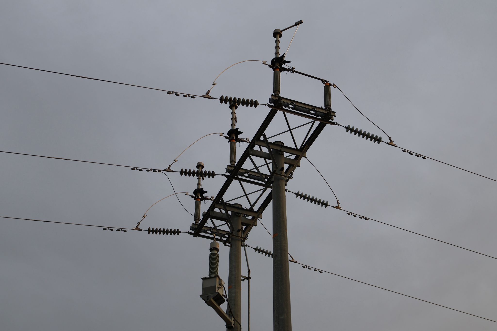 High-voltage transmission infrastructure with insulators and power lines