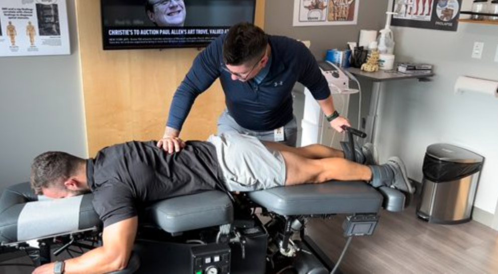 dr mac treating a man on the treatment table