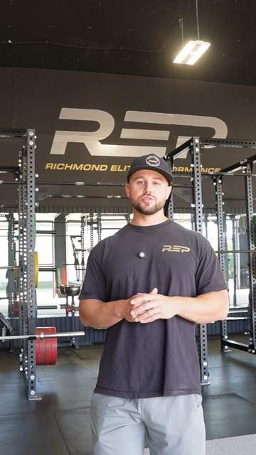 Coach Jared in the REP weight room welcoming Iowa Select Volleyball families