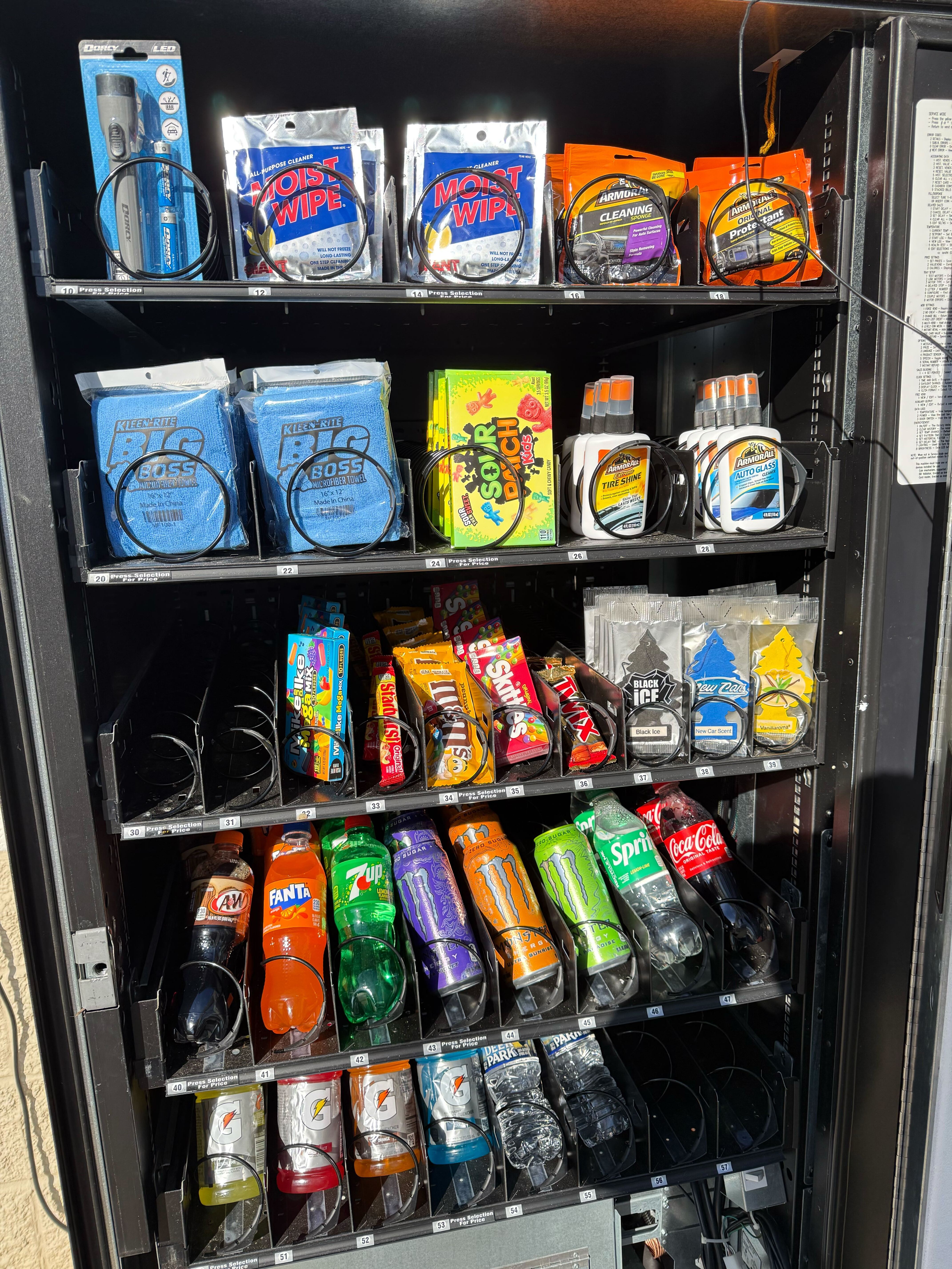 On-site vending machine with car cleaning supplies, snacks and beverages
