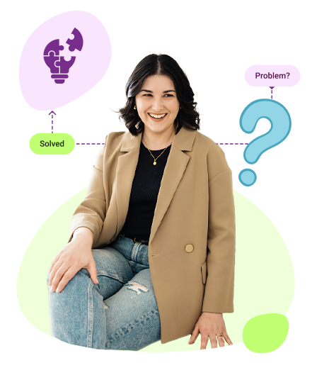 An illustration of a person sitting at a desk, looking stressed or confused, with their hands on their head. A laptop is open in front of them, and a speech bubble above shows a video play button with a progress bar. On the desk are stacks of books, a coffee cup, and a small potted plant. A purple question mark hovers nearby, suggesting frustration or uncertainty.