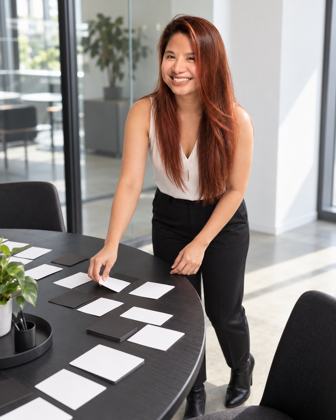 Janellyn Briones organizing work at a table