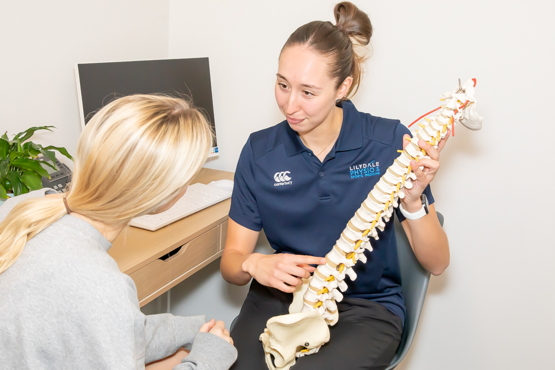 Physiotherapist helping a patient with injury recovery and rehabilitation