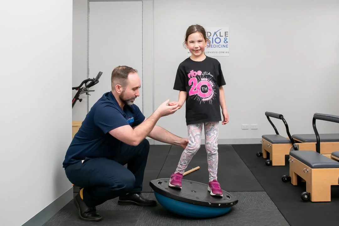 Physiotherapist working with a young patient