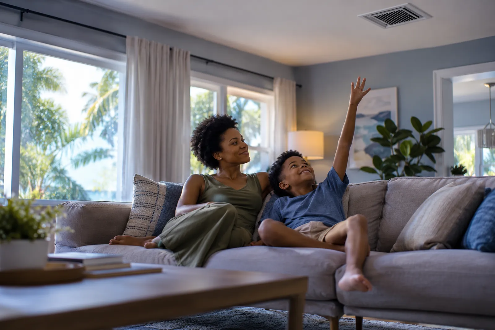 Mother and son relaxing in a cool living room