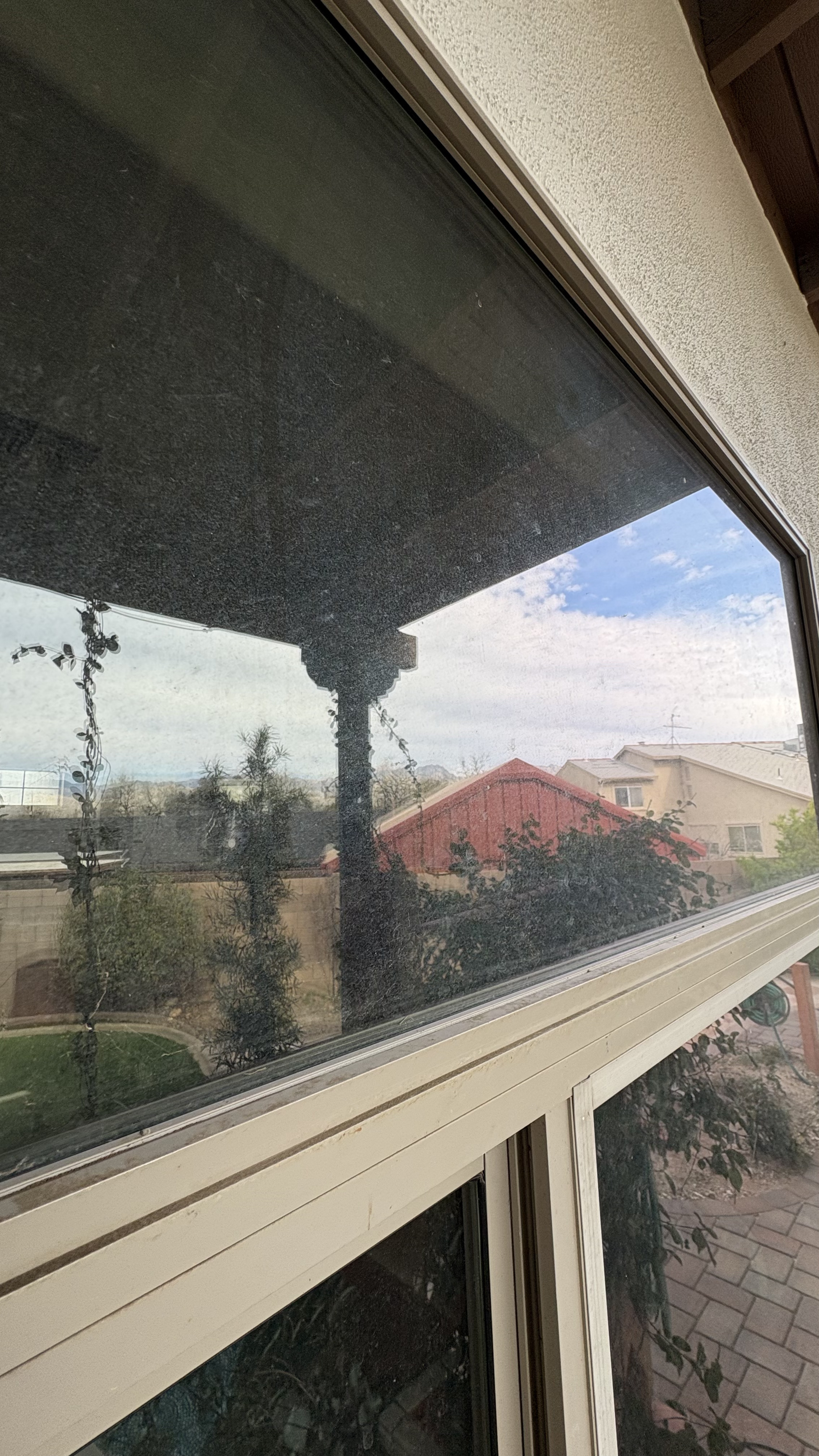 dirty exterior window with heavy dust buildup before window cleaning service in Tucson AZ