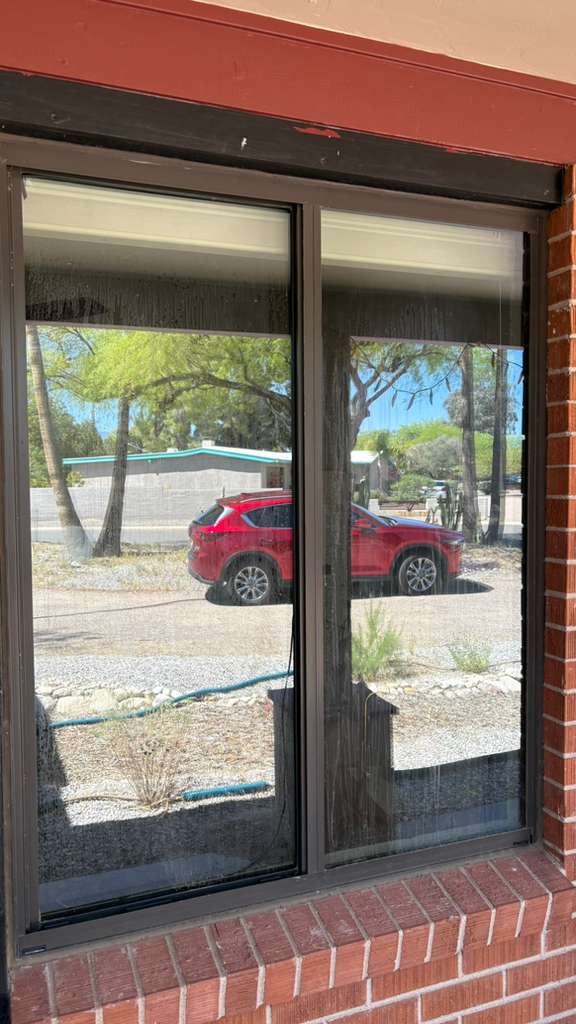 before window cleaning service Tucson AZ dirty residential glass with streaks and buildup