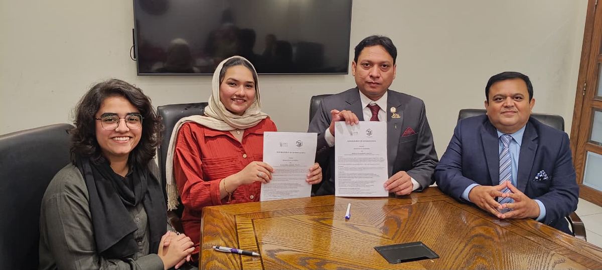 DOL and Pinnacle representatives holding the signed MoU