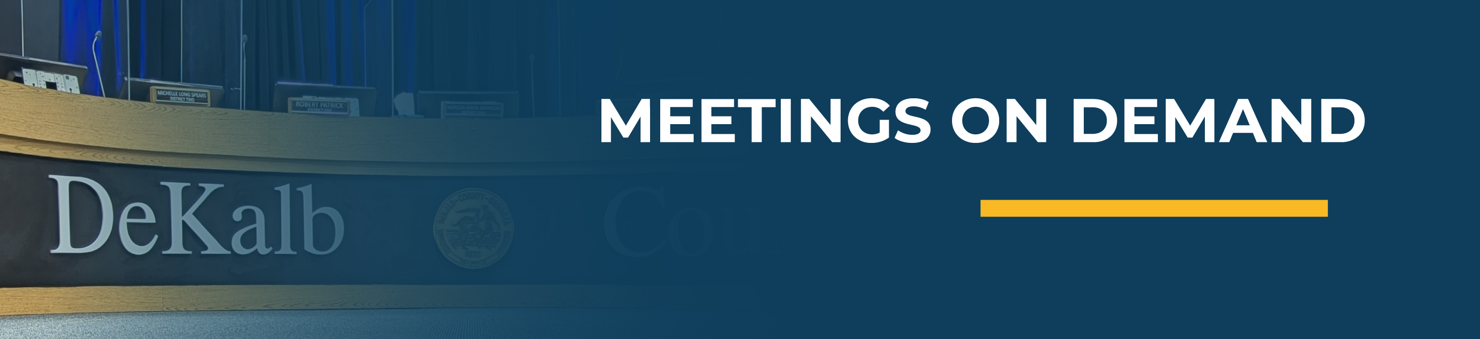 Banner reading “Meetings on Demand” over an image of a DeKalb County commission chamber. Click to watch recorded county meetings online.