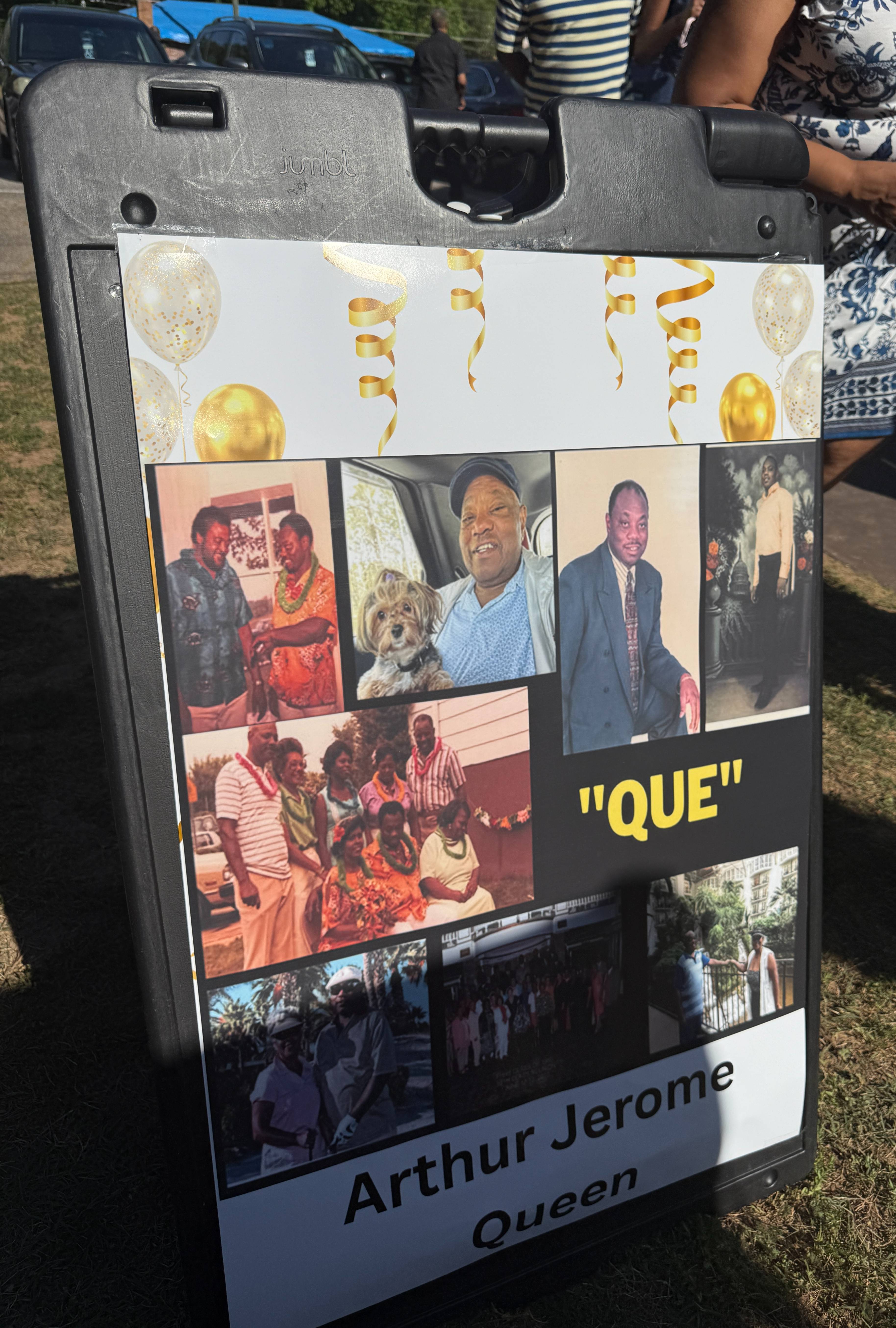 Poster board with a collage of photos showing Arthur Jerome “Que” Queen at different stages of life, including family gatherings and portraits, displayed during the street renaming ceremony.