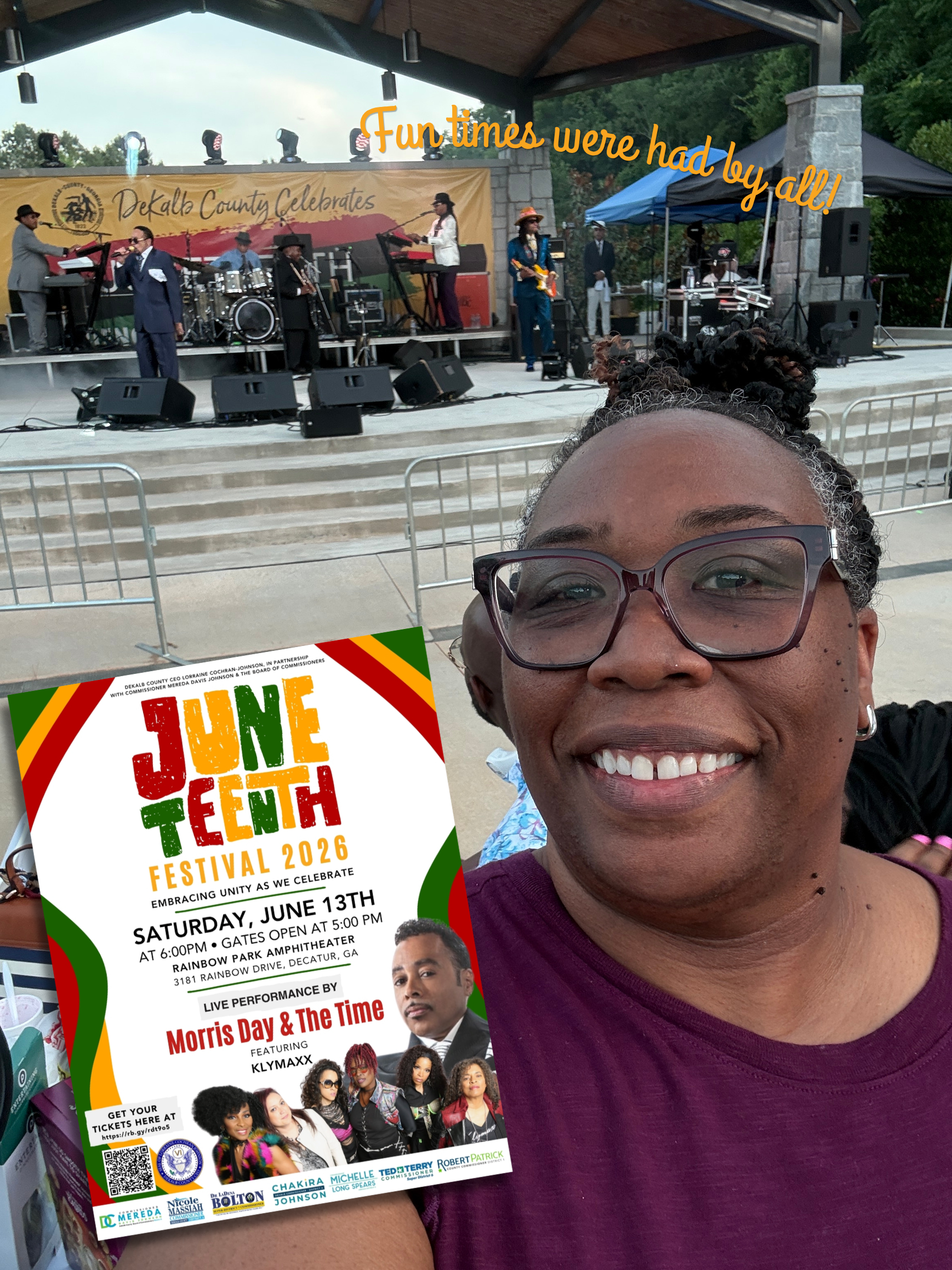 Selfie of Commissioner Chakira Johnson smiling at the JuneTeenth Festival 2026 at Rainbow Park Amphitheater in DeKalb County. A live band performs on stage in the background beneath a 
