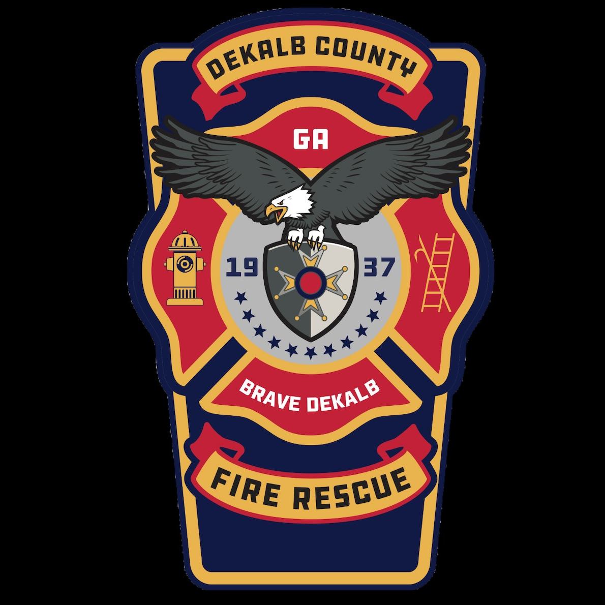 DeKalb County Fire Rescue shield emblem in red, navy and gold, featuring a bald eagle with outstretched wings above a firefighter insignia, with a fire hydrant and ladder on either side. The emblem reads “DeKalb County,” “GA,” “Brave DeKalb” and “Fire Rescue.”
