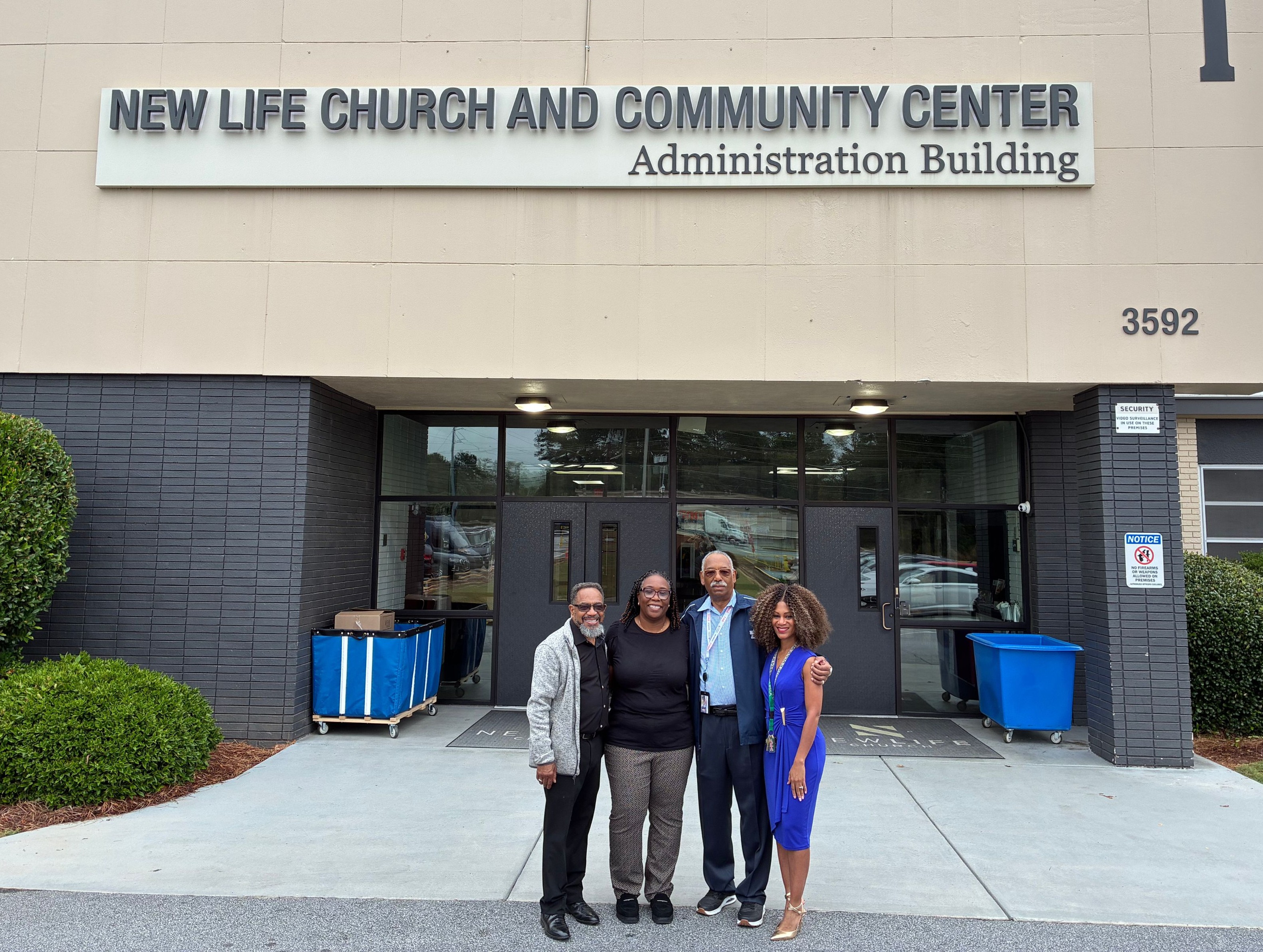 Presiding Officer Commissioner Chakira Johnson stands with community partners outside New Life Church and Community Center during an Oct. 5 visit to the South DeKalb Day Center.