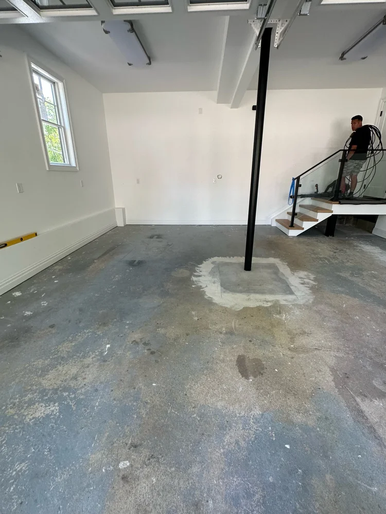 Bare concrete garage floor before epoxy coating in West Long Branch, NJ